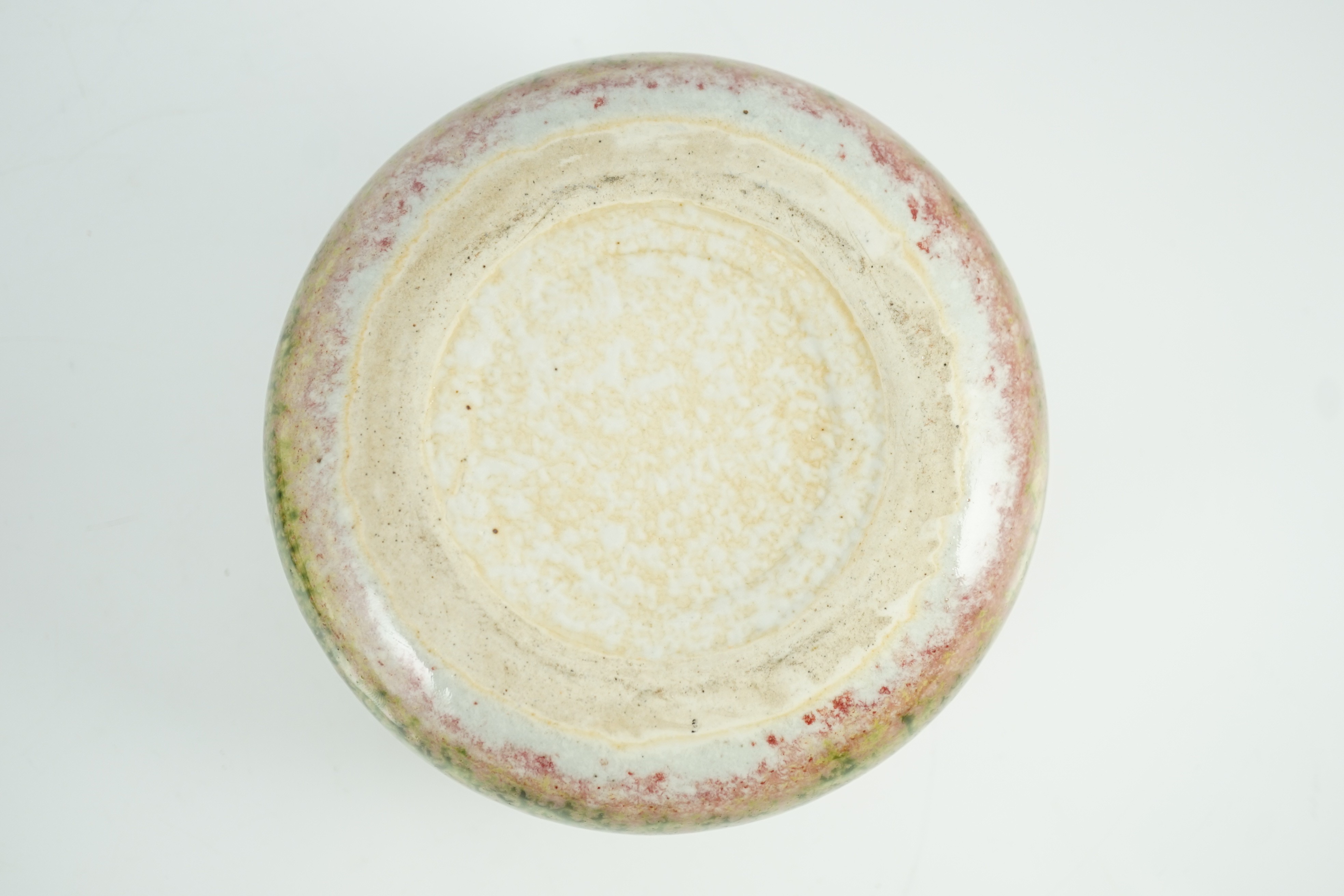 A Chinese peachbloom glazed weiqi stone box and cover, 20th century, 13.5cm diameter